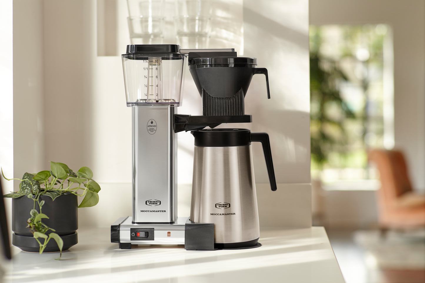 Moccamaster KBGT brewer on kitchen counter.