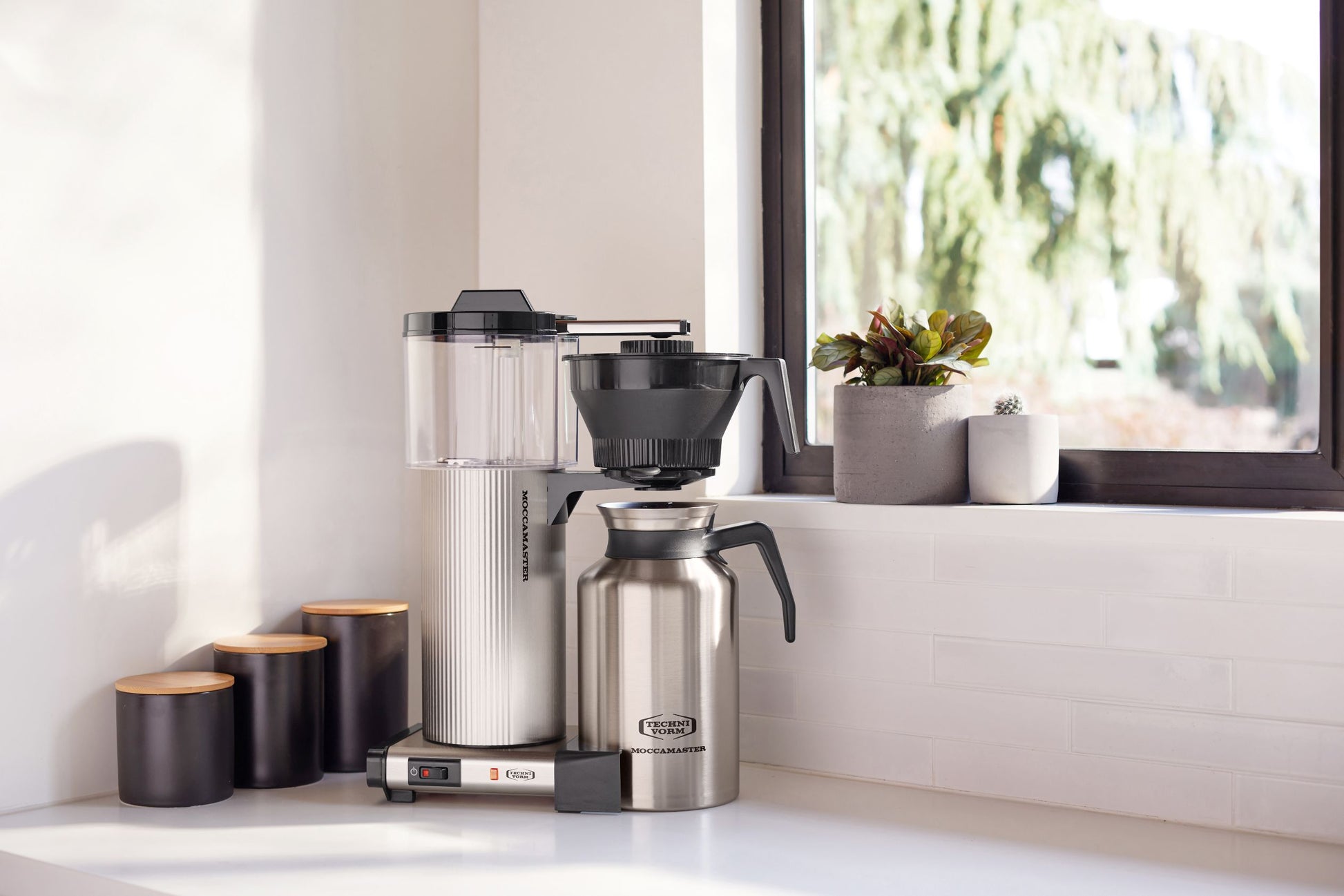 Moccamaster CTD Grand on a kitchen counter with a window in the background