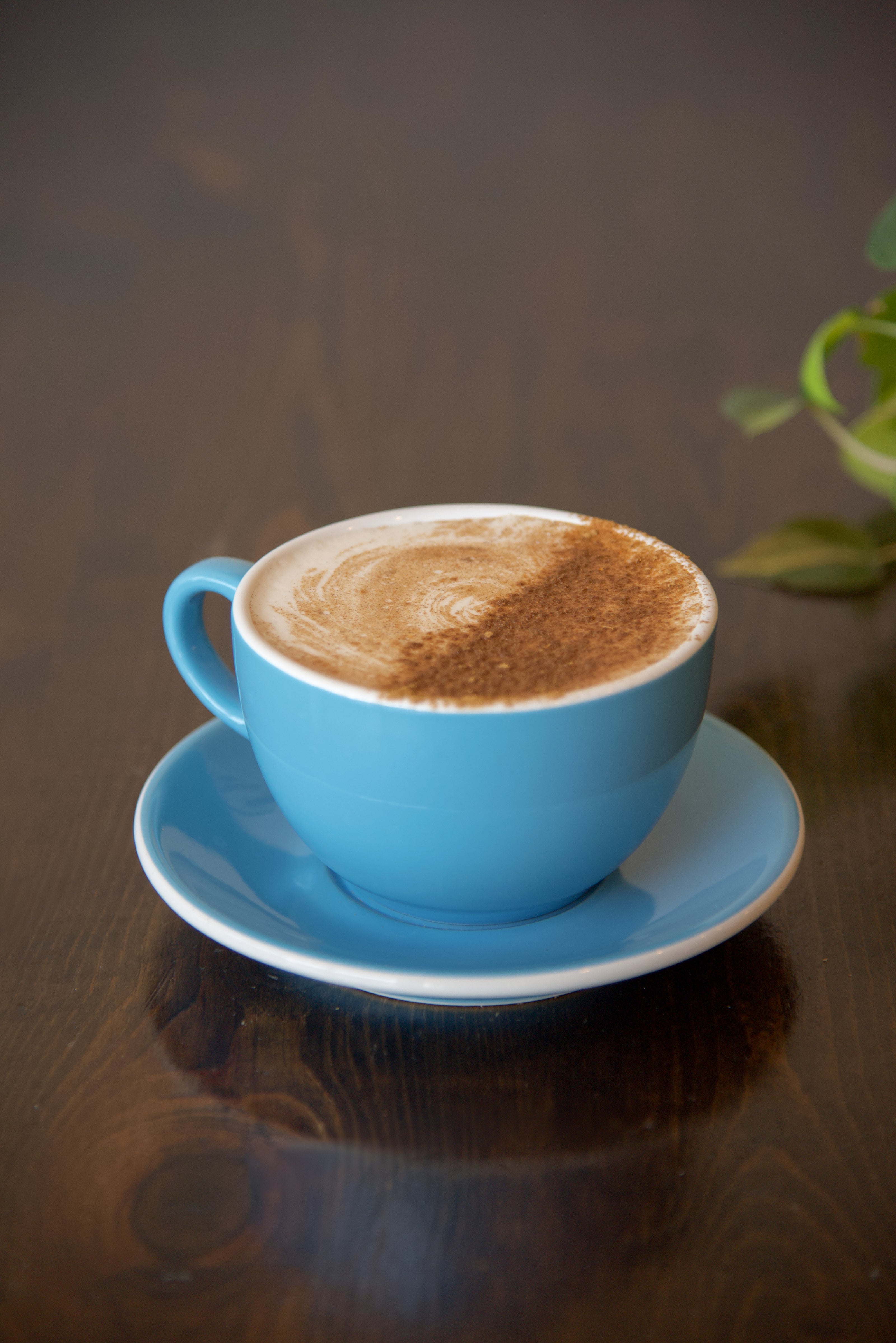 Chai latte in a mug for here.