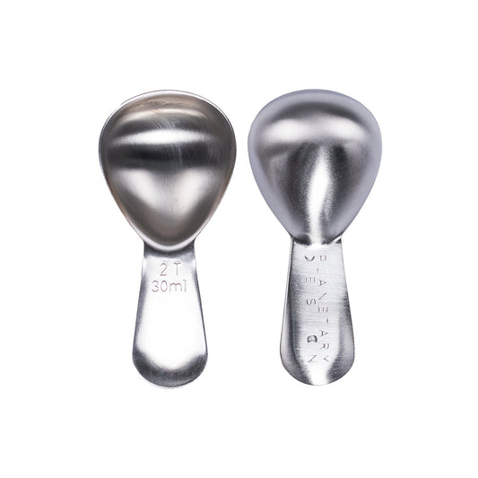 Two silver measuring spoons on a white background