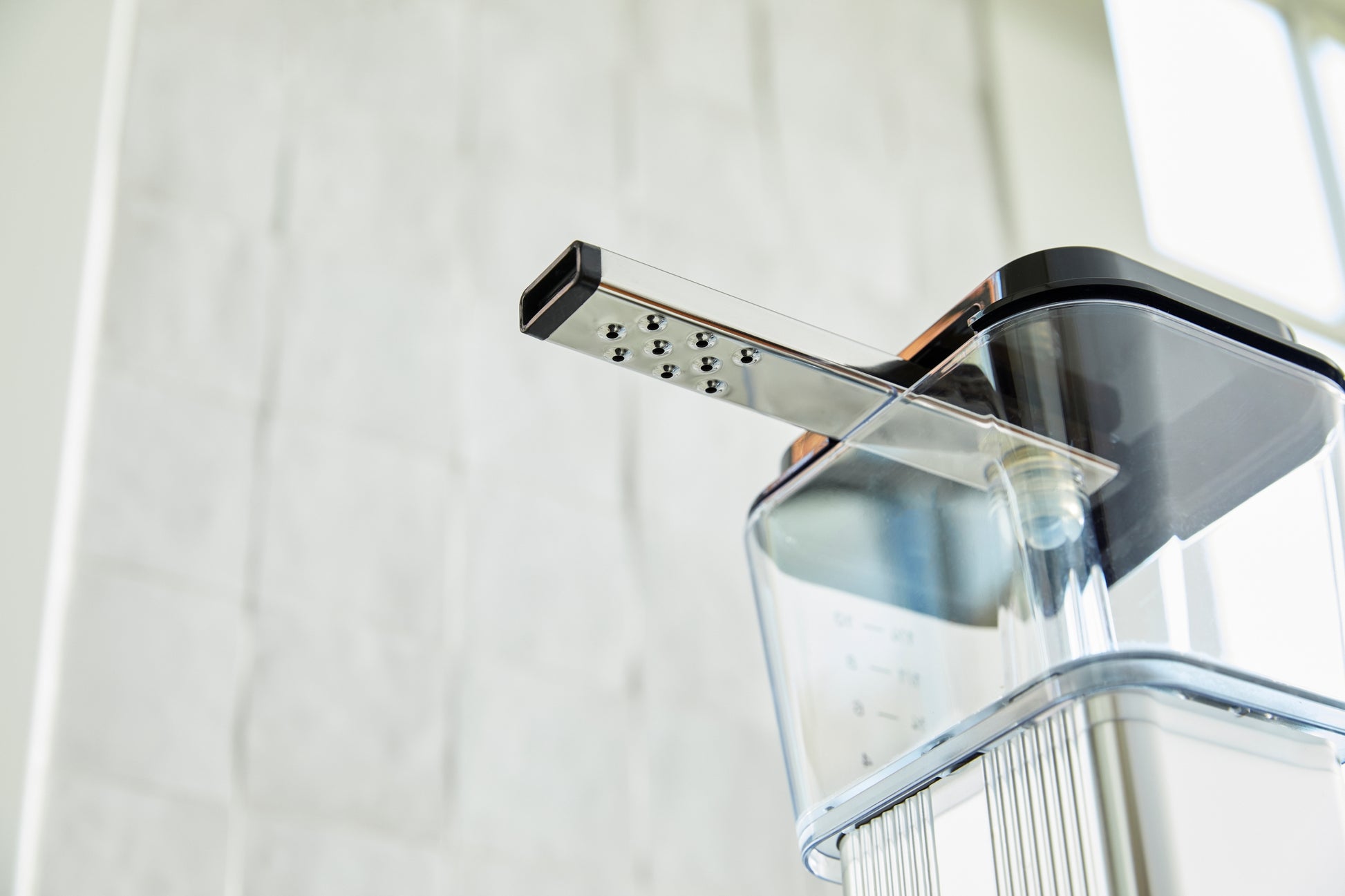 Moccamaster shower head and arm on a white background